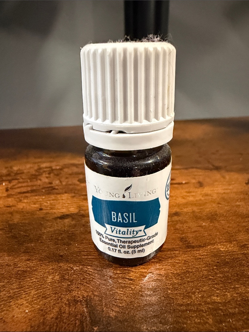 Young Living Basil Essential Oil Bottle with White Cap and Blue Label